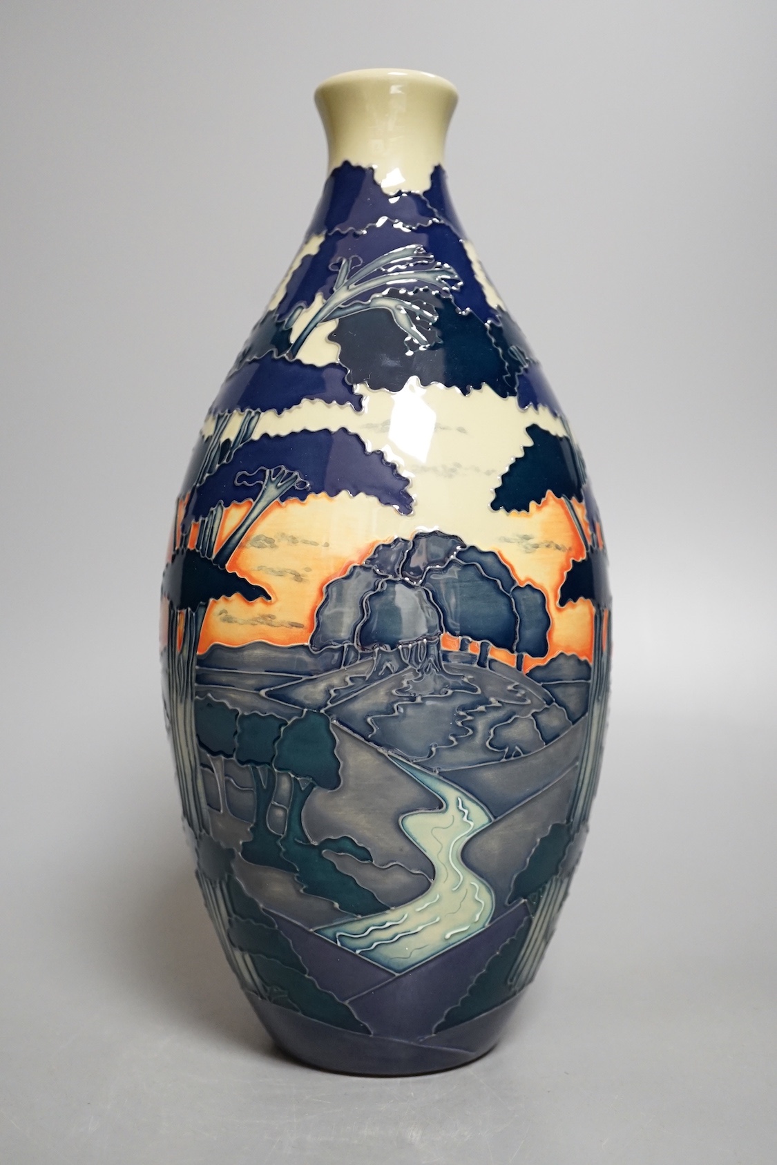 A Moorcroft 'trees in a dusky landscape' trial vase, boxed, 23.5 cms high.